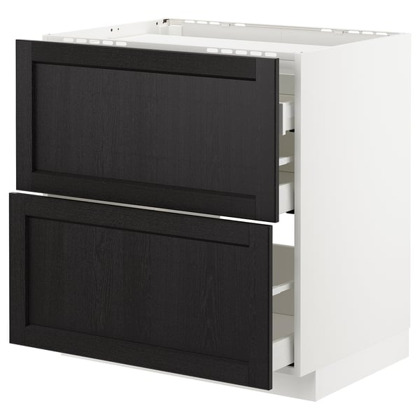 Black stained wooden drawers in white kitchen cabinet, traditional style.