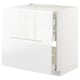 White high-gloss cabinet with integrated handles and drawers in METOD system.