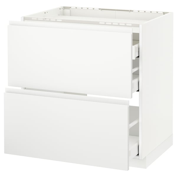 White modern kitchen cabinet with smooth drawers, minimalist design.