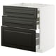 Modern black and white kitchen drawer unit with three drawers.