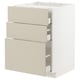 A white ikea METOD kitchen base cabinet with beige drawers. It three self-closing drawers with a sleek, modern design.