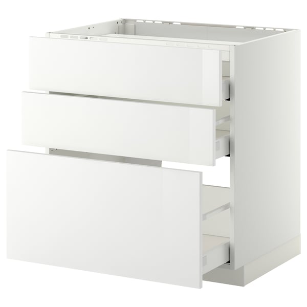 A white METOD kitchen cabinet with three drawers, a sleek modern design, and high-gloss finish.