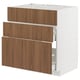 A METOD kitchen cabinet with tistorp walnut drawers and a white base. It has three vertical drawers and is designed for storage.