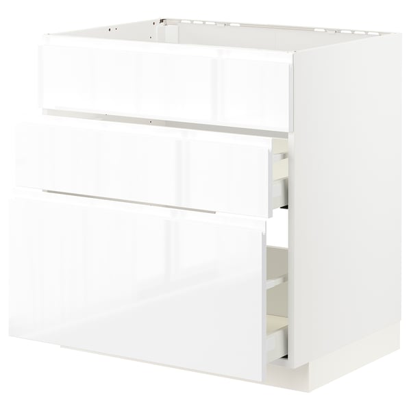 White METOD kitchen cabinet with glossy finish & integrated handles.