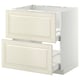 Off-white cream styled kitchen cabinet with beveled drawer fronts. METOD frame construction with smooth-slide drawers.