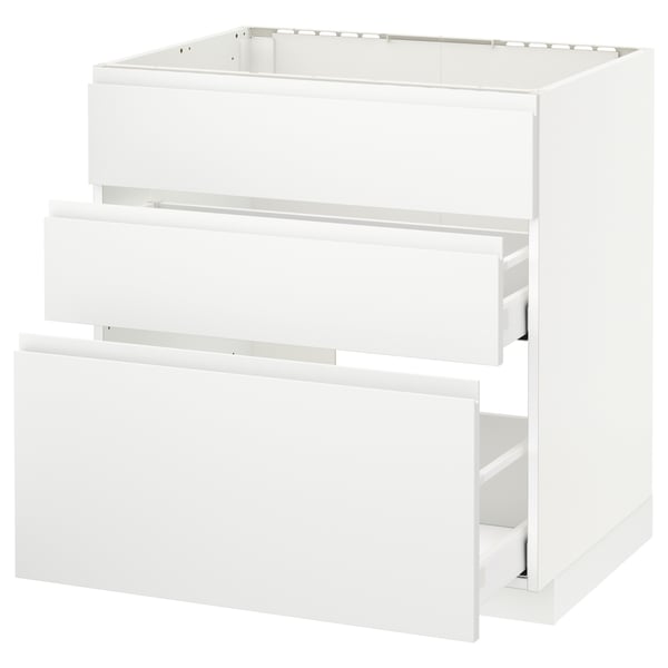 White METOD kitchen unit with three open drawers, sleek minimalist design.