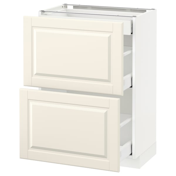 A white METOD kitchen cabinet with off-white bodbyn fronts and bevelled edges. It two drawers with smooth runners.