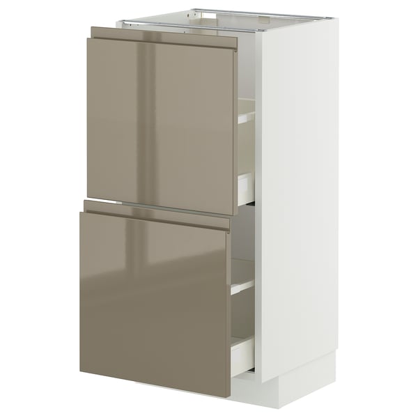 A white METOD kitchen unit with high gloss dark grey-brown drawers.