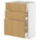 A white METOD base kitchen cabinet with three oak drawers, featuring self-closing mechanisms and wooden handles.