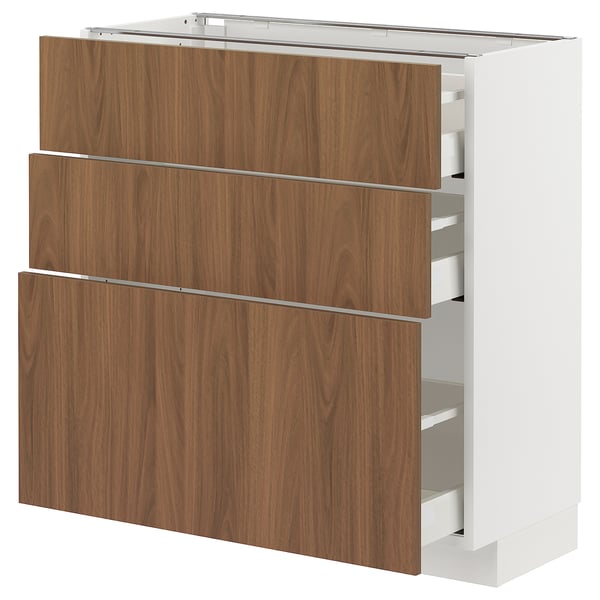 Walnut-colored kitchen unit with three drawers and white sides. Modern, minimalist design. Self-closing drawers.
