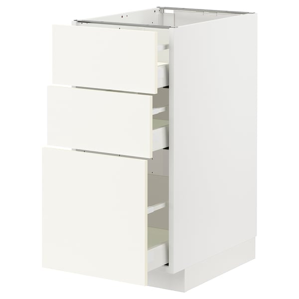 White METOD kitchen cabinet with three semi-open drawers, sleek modern design.