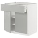 Modern white kitchen cabinet with single drawer and shelf.