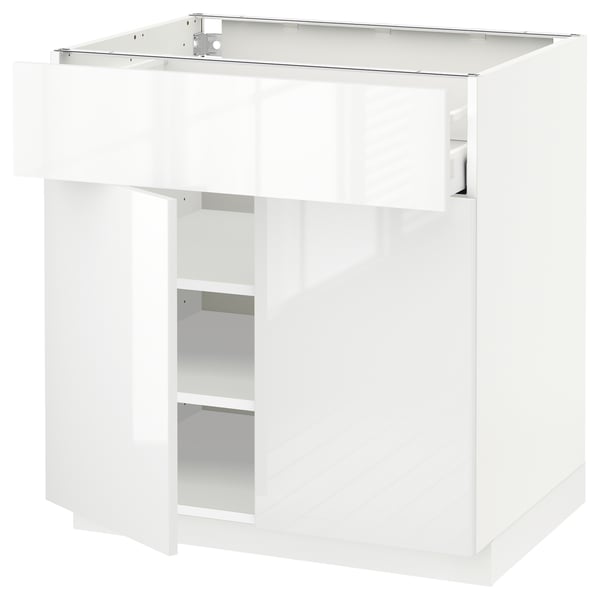 White high-gloss kitchen cabinet, square shape, modern design, with drawer and shelves.