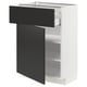 A white ikea METOD cabinet with black nickebo drawers and shelves, modern and sleek design.