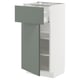 METOD kitchen cabinet with grey-green drawer & white shelves.