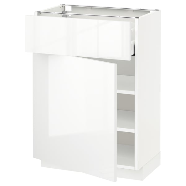 A high-gloss white METOD kitchen cabinet with glass doors and adjustable shelves. It has a sleek, modern look.