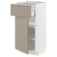 Modern kitchen cabinet in matte grey-beige with two pull-out drawers, sleek handle, and adjustable shelves.
