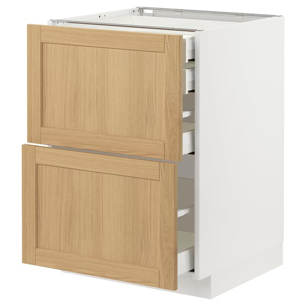 White METOD kitchen unit with oak drawers and beveled edges.