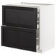 Modern white kitchen cabinet with black drawers, framed edges.