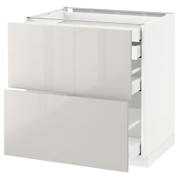 White METOD kitchen cabinet with glossy finish and drawers.