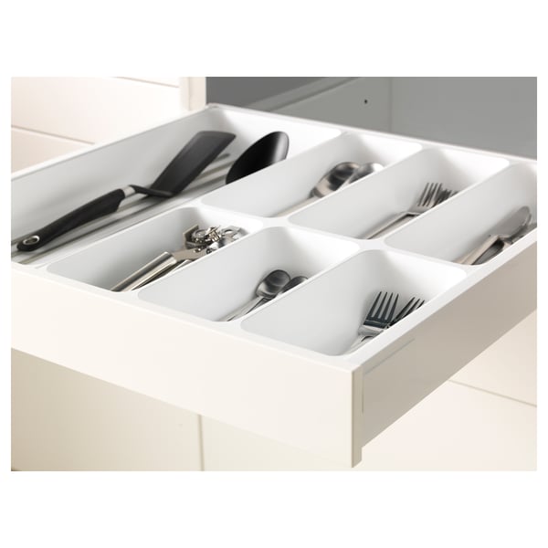 White kitchen drawer organiser, holding utensils, with high gloss finish and smooth-close mechanism.