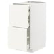 A white METOD kitchen cabinet with two drawers and an open door, revealing shelves inside.