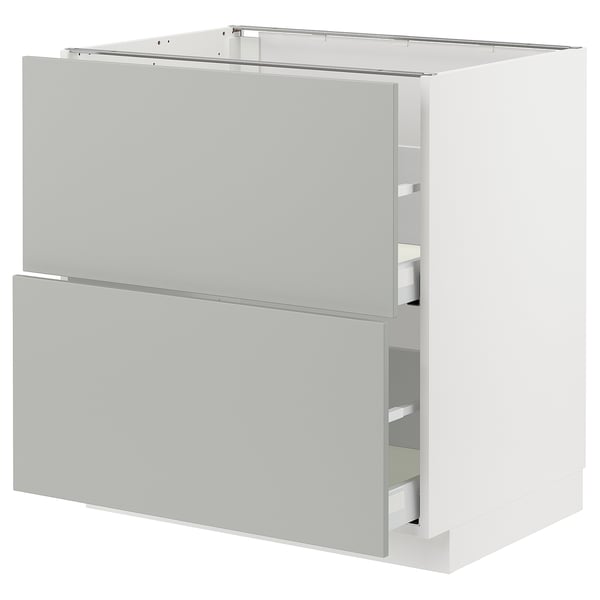 White METOD kitchen cabinet with grey drawers, modern and clean design.