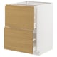 A METOD kitchen cabinet with a white and light wood design. It two drawers with integrated handles.
