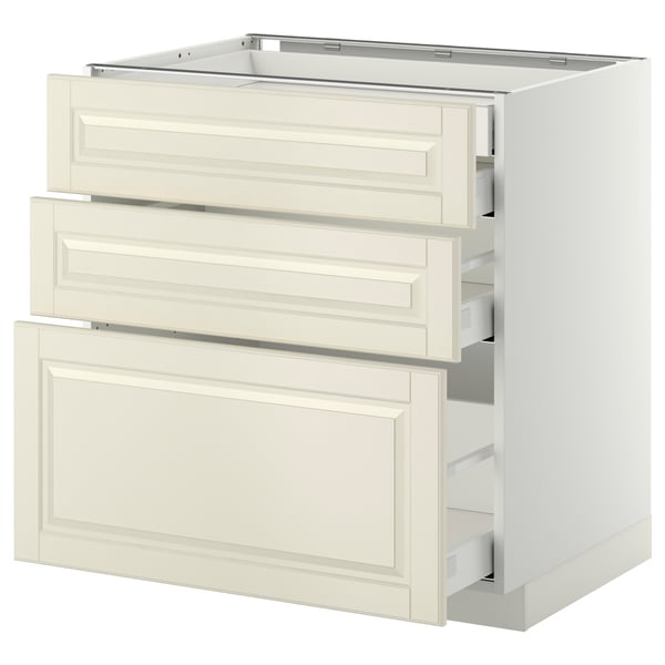 A white METOD kitchen cabinet with three drawers and a door, featuring a classic off-white look.
