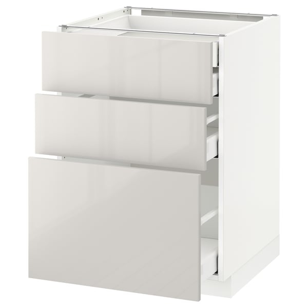 A white METOD kitchen cabinet with three drawers, featuring a sleek, modern design in glossy finish.