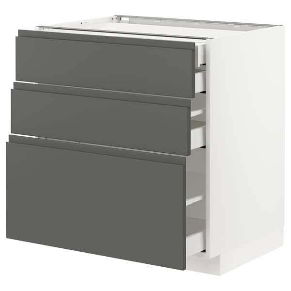 Modern kitchen unit, METOD. White base, dark grey handles. Three drawers, sleek design.
