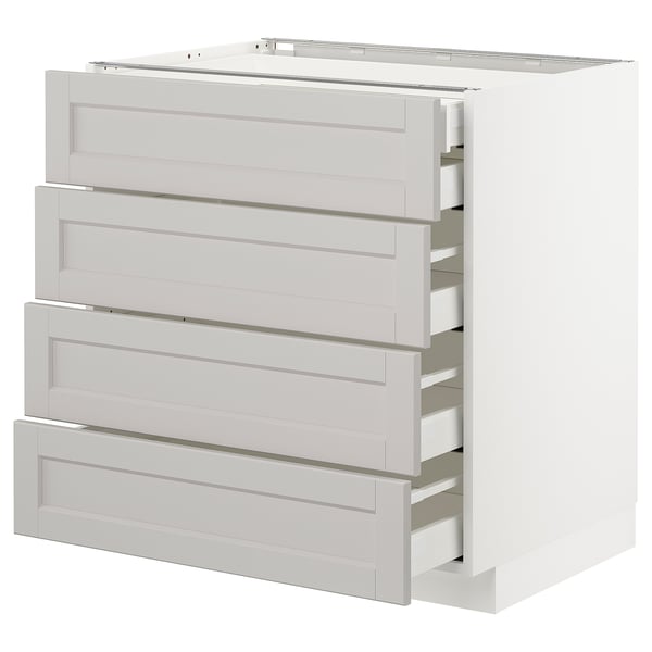 White METOD kitchen cabinet with four bevelled grey drawers.