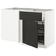 Modern white and black kitchen unit with pull-out shelf and open drawer, sleek minimalist design.