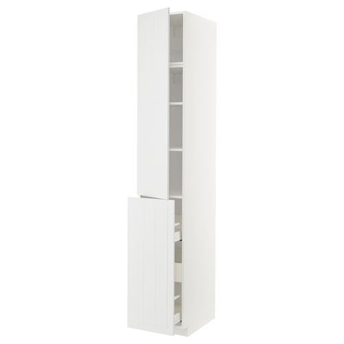 A white METOD kitchen cabinet with two open doors revealing shelves inside.