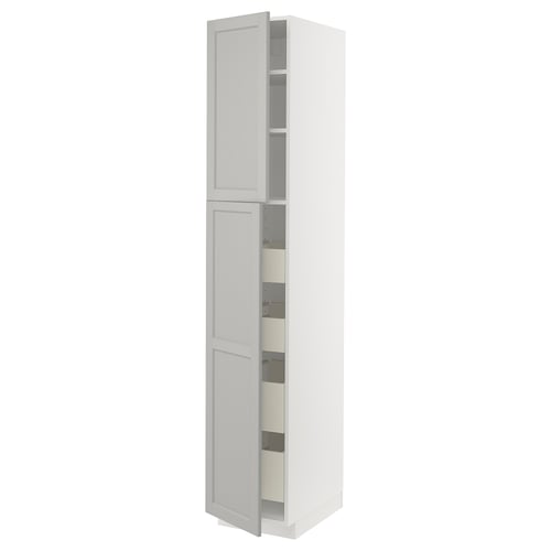 A white METOD kitchen cabinet with open doors and visible shelves.