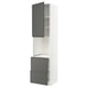 White kitchen cabinet with dark grey drawers. Tall, slim design with open shelves. Modern, sleek look.