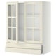 Off-white METOD kitchen cabinet with glass doors and drawer.