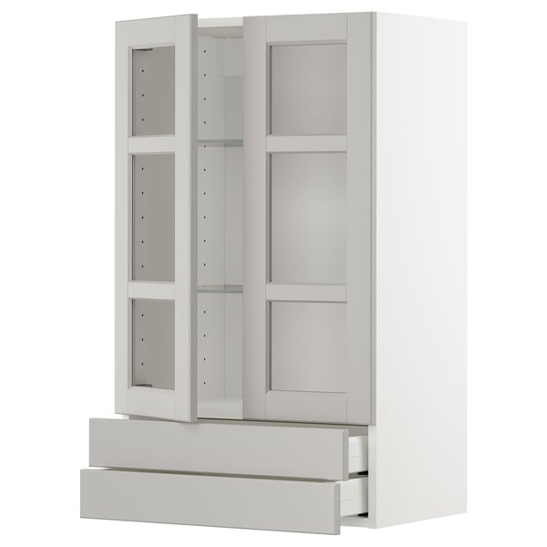 White METOD kitchen unit with glass doors, adjustable shelves, and drawers.