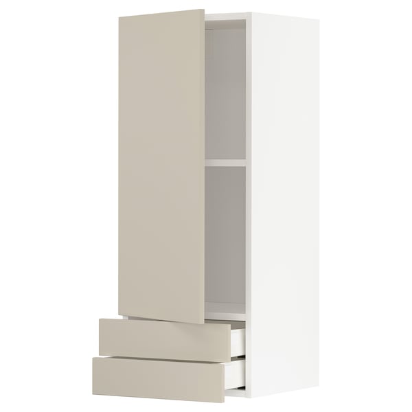 A beige METOD kitchen cabinet with two drawers and an open adjustable shelf. Its sleek, modern design a smooth finish and sturdy frame construction.