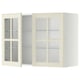 Off-white kitchen cabinet with glass doors and shelves.