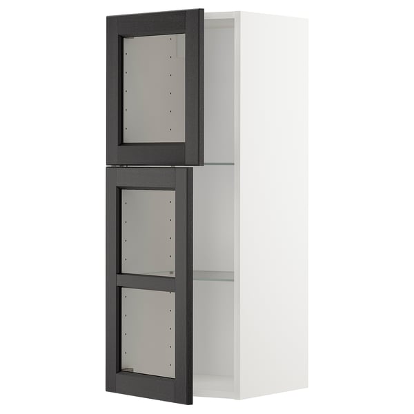METOD kitchen cabinet with black stained glass doors and white frame.