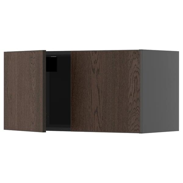 Dark brown wooden cabinet with one open door, part of ikeas METOD kitchen system.