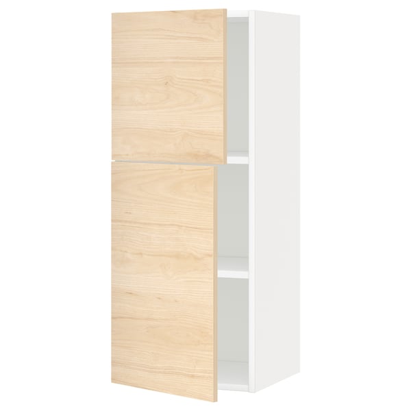 Light wood and white cabinet, two doors open revealing shelves.