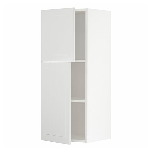 A white METOD kitchen cabinet with two doors. It is rectangular and modern, designed for storage.