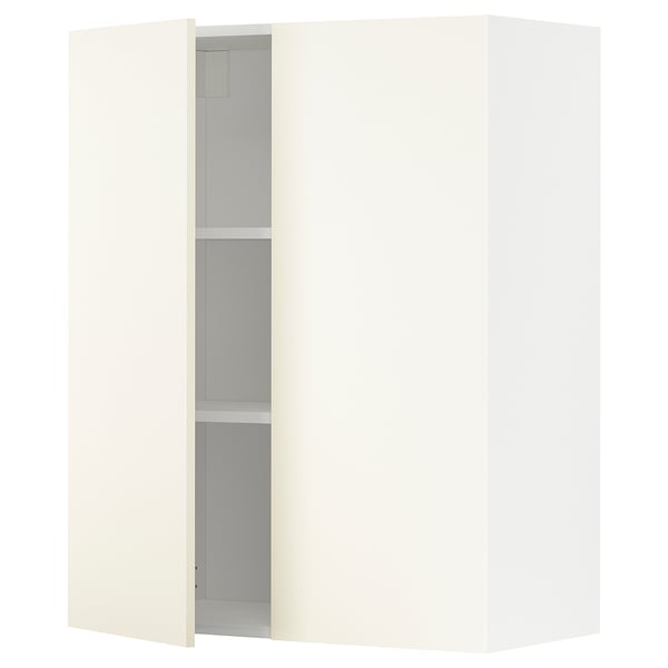 A white METOD kitchen cabinet with a single open door revealing a shelf inside.