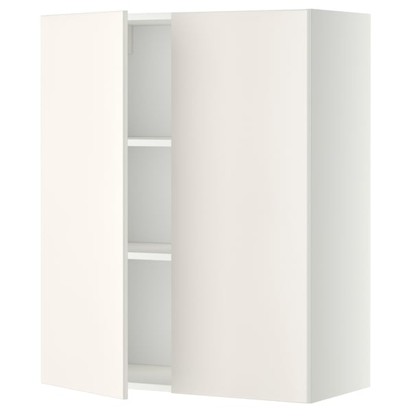A white METOD wall cabinet with two open doors revealing an adjustable shelf inside.