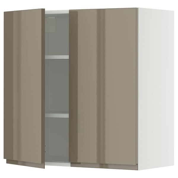 Modern high-gloss beige kitchen cabinet with sleek handles and adjustable shelves.
