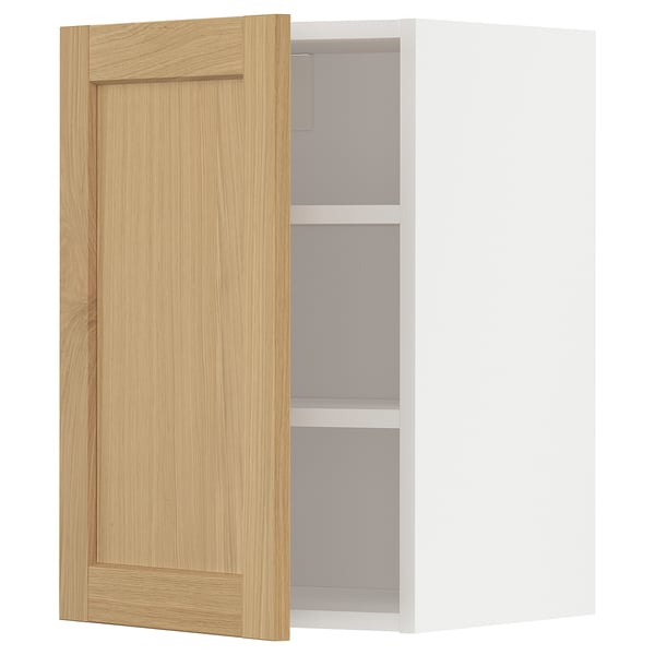 METOD kitchen cabinet: light wood door, white interior, minimalist design.