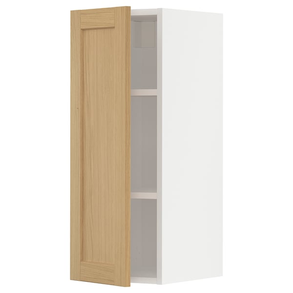 A white METOD kitchen cabinet with a light oak door, featuring a simple, rectangular design and beveled edges.