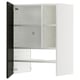 A white METOD kitchen cabinet with a black door and beveled edges. It has adjustable shelves and a 25-year guarantee.